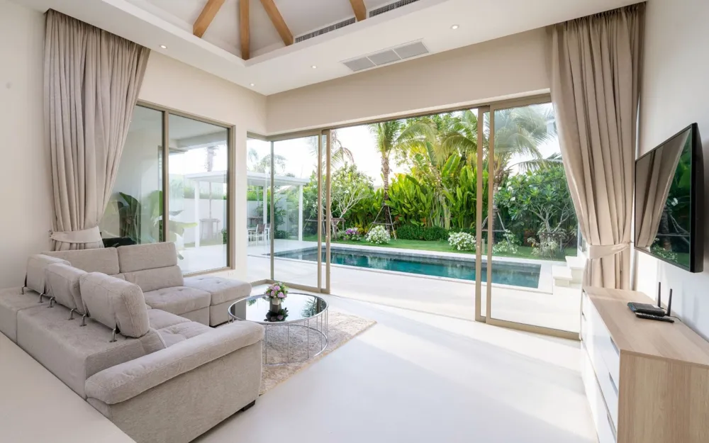 Bright living room opening onto a pool