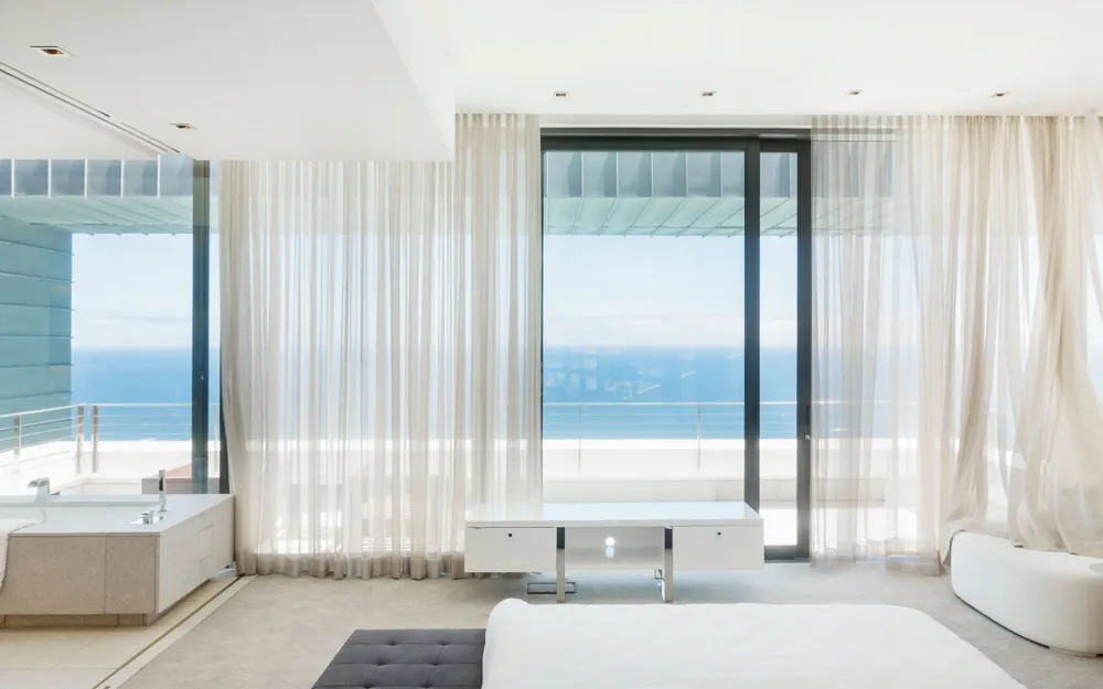 Oceanfront luxury bedroom with water views