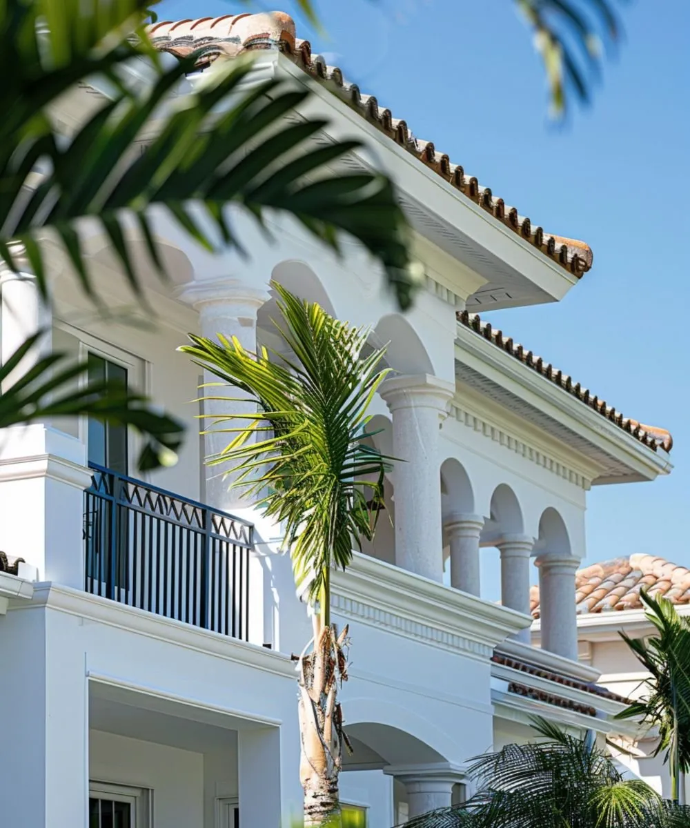 Mediterranean-style home exterior with palm trees